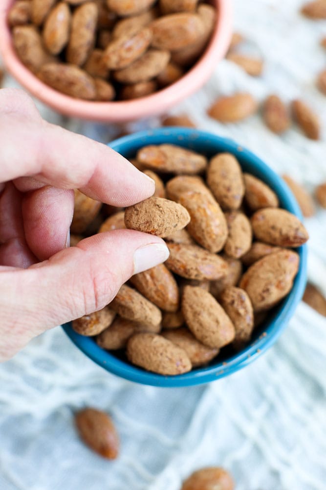 holding a Cocoa Dusted Almonds Recipe