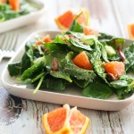 This Power Greens Salad with Cara Cara Orange, Almonds, and Parmesan is anything but boring! Brighten up your winter with this perfect salad.