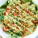 Spinach Salad with Quinoa, Crispy Chickpeas, Tomato, and Avocado Basil Dressing. A hearty, filling salad that can be a meal in itself! Easy healthy vegan recipe.