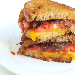 The Ultimate Grilled Cheese Sandwich with Caramelized Onions and Tomato. This is the BEST recipe for twist on the classic grilled cheese. So much better!