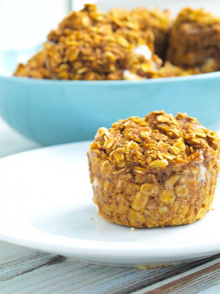 These Pumpkin Spice Baked Oatmeal cups are a perfect portable, breakfast to go idea! It's a healthy recipe with 100% whole grains and low sugar. The flavor is perfect for fall, but I will eat these all year.