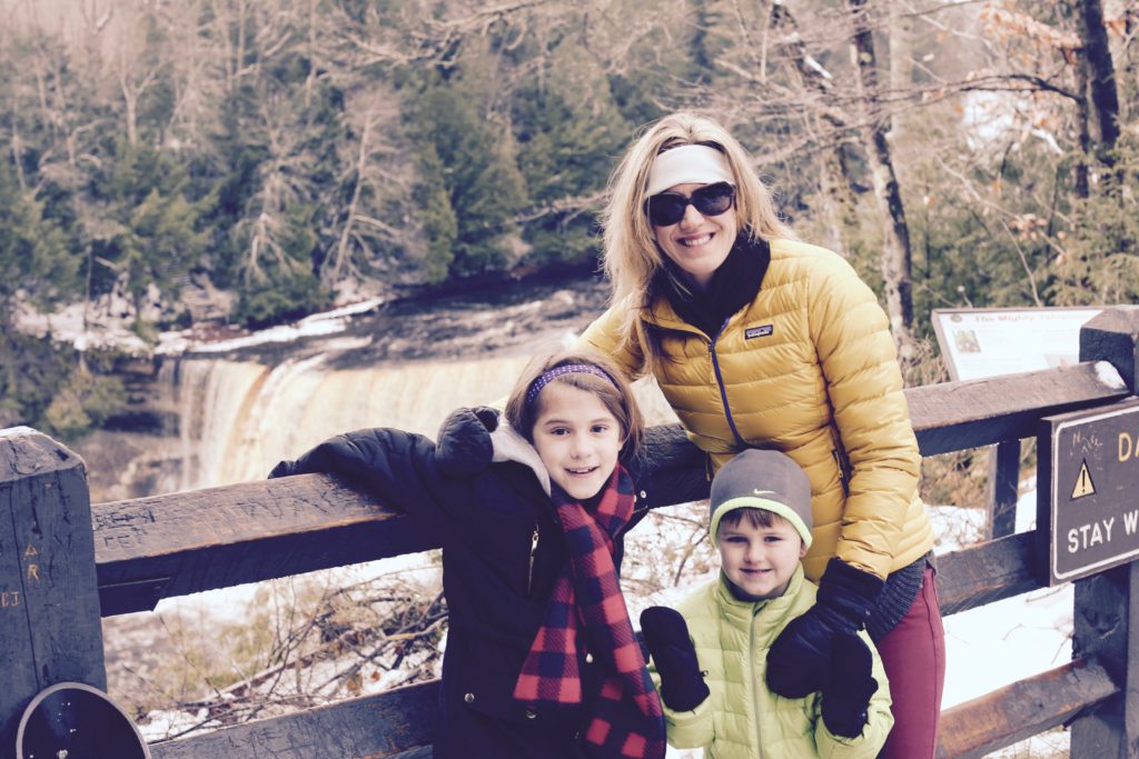 Mom with 2 kids smiling--how to not lose yourself in motherhood