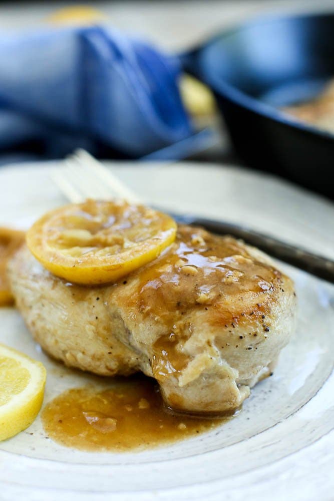 Easy Lemon Skillet Chicken Recipe--One breast with a lemon on top