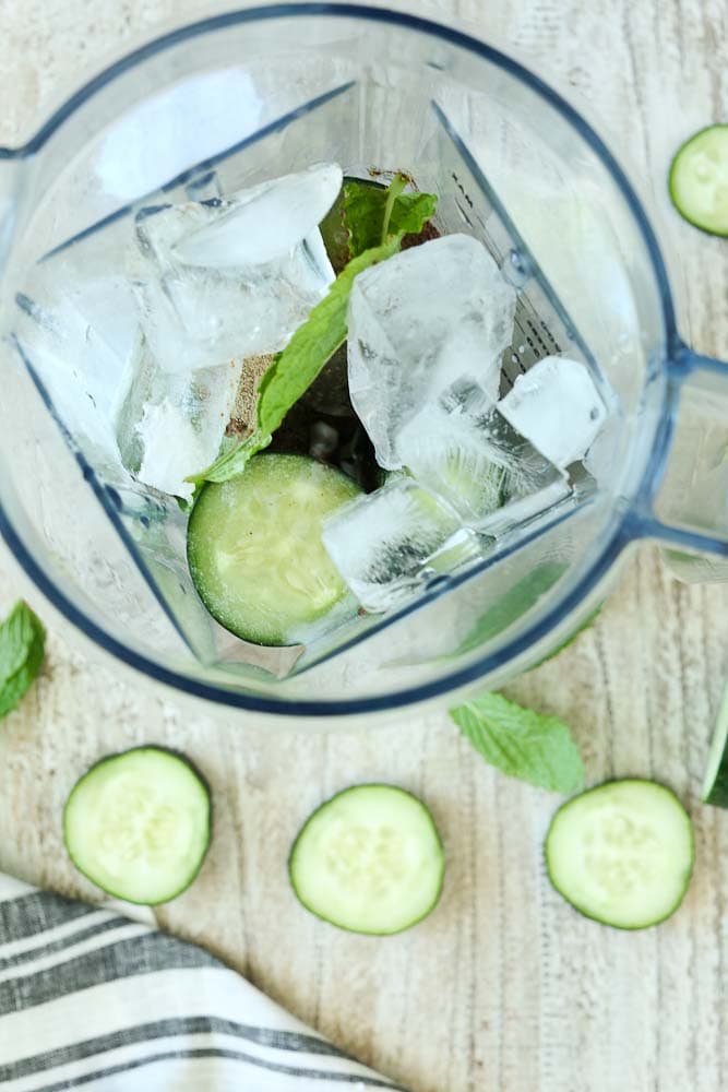 blender showing ingredients for Energizing Cucumber Mint Smoothie Recipe