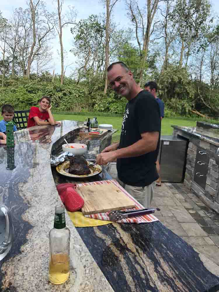 Tim cutting the beef