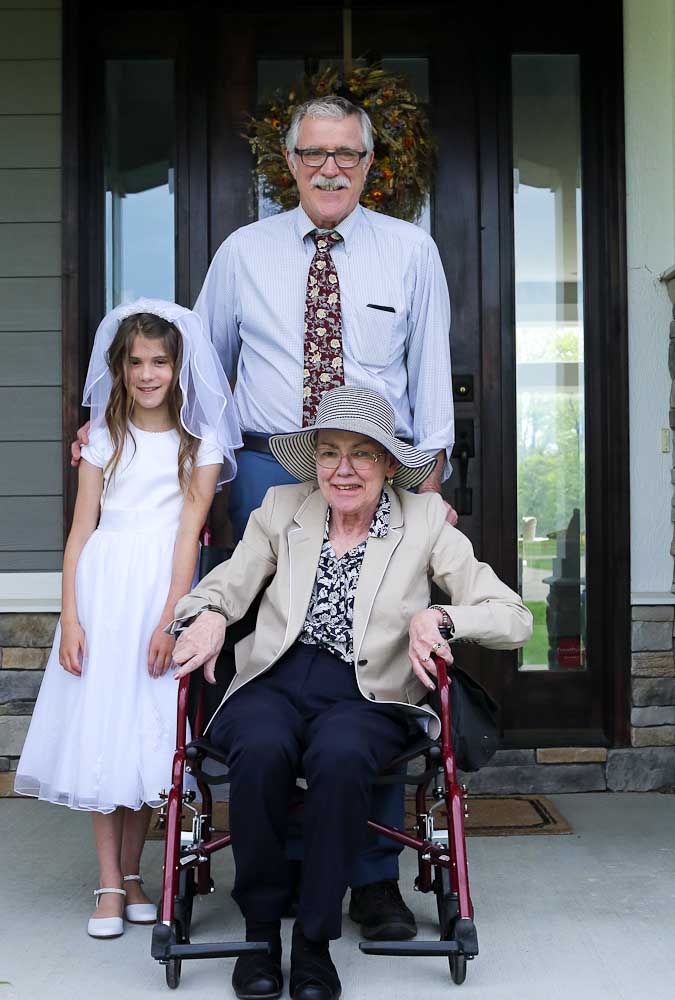 Meghan with Grammy and Papa first communion
