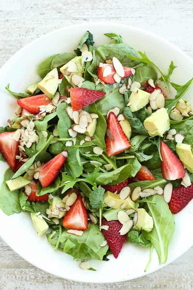 Strawberry Spinach Salad with Avocado and Strawberry Vinaigrette dressing pictured without the dressing