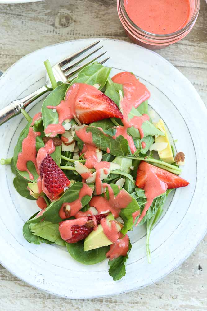 Strawberry Spinach Salad with Avocado And Strawberry Vinaigrette recipe served