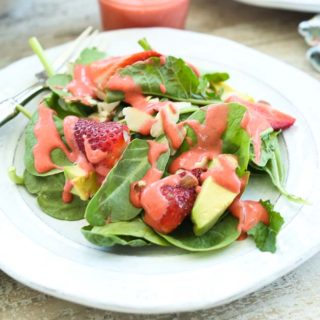 Close up picture of Spinach Strawberry Salad with Avocado and Strawberry Vinaigrette