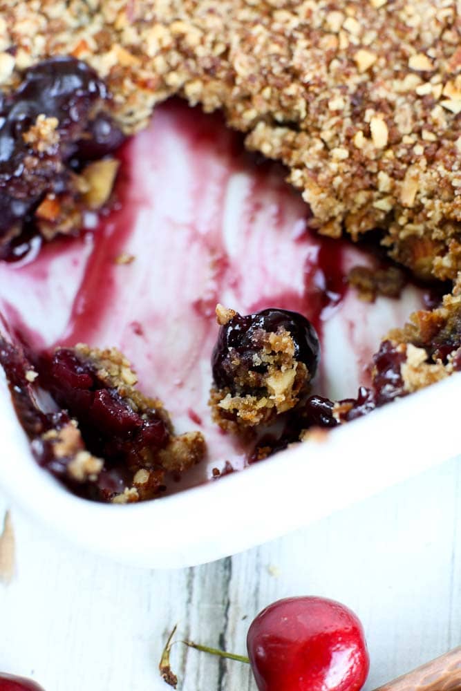 Fresh Cherry Crumble Recipe--close up of the baking dish with a portion removed