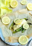 Baked Halibut in parchment with asparagus and lemon and a mustard dill sauce