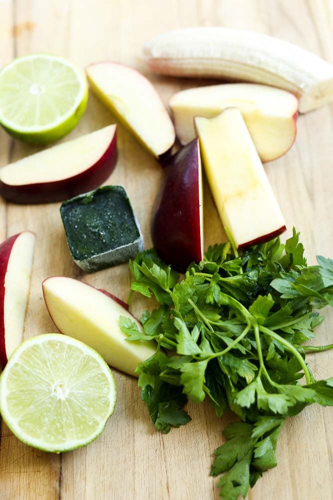 Ingredients for the Wake Me Up Green Smoothie Recipe (parsley, lime, apple, spinach cube)
