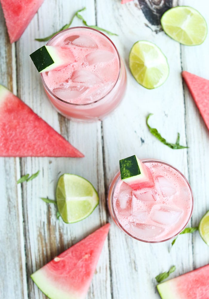 Watermelon Daiquiri with Basil Recipe overhead shot with limes and watermelon wedges