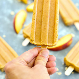 Holding a peach crisp popsicle==healthy homemade popsicle recipe