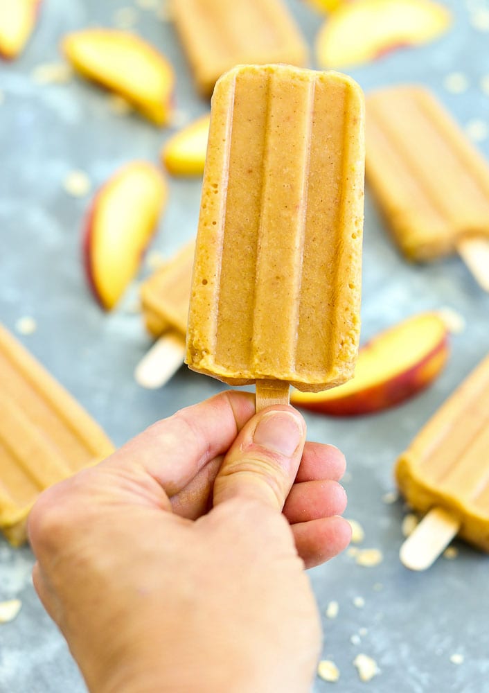 Holding a peach crisp popsicle==healthy homemade popsicle recipe