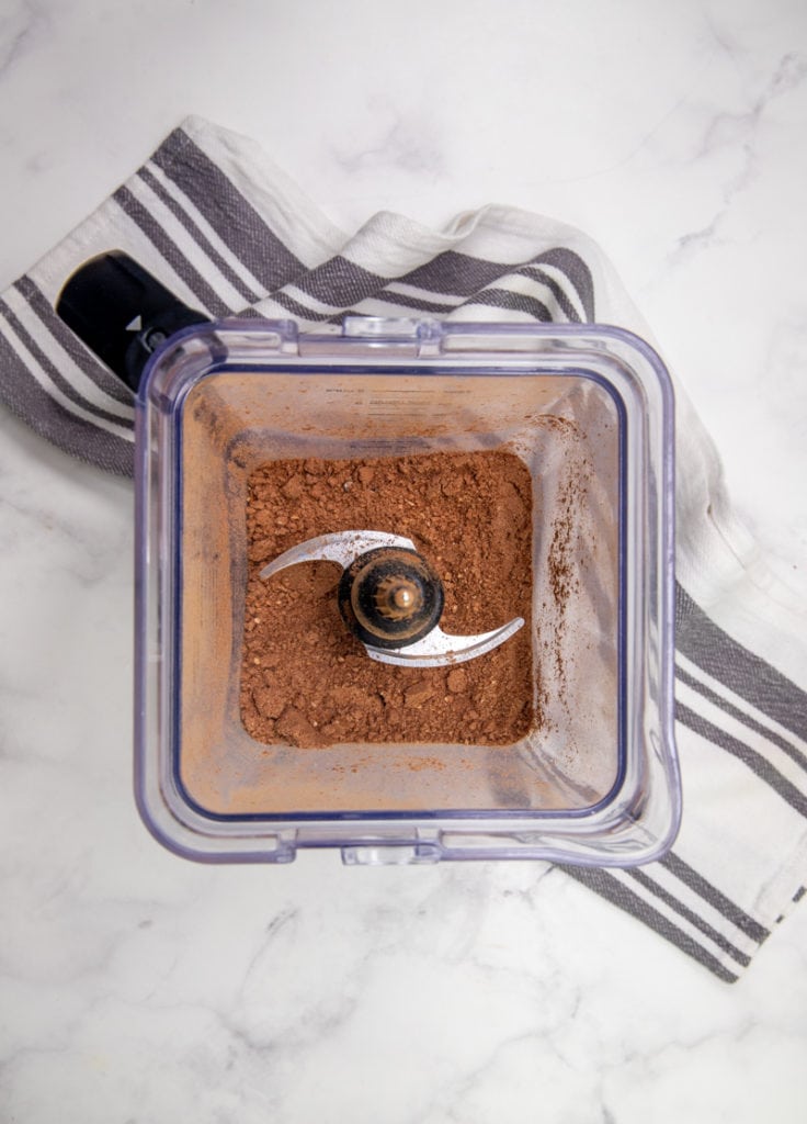 overhead shot of a blender with cocoa powder