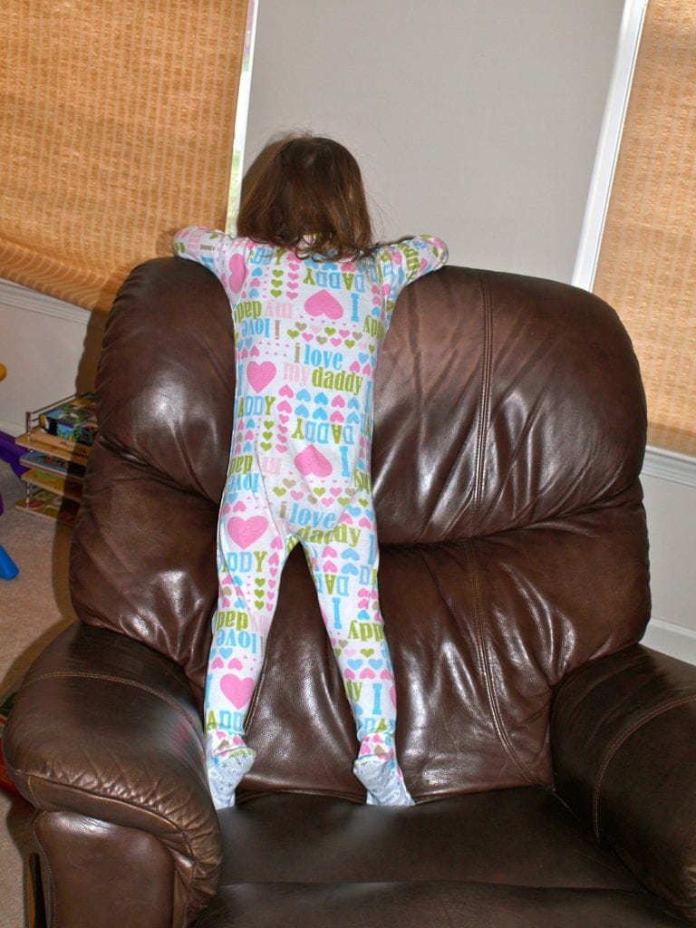Meghan standing on chair