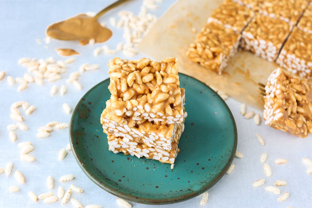 Healthier Than Rice Krispy Treats- peanut butter cereal bars recipe stacked on a plate