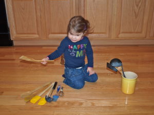 Meghan playing in kitchen