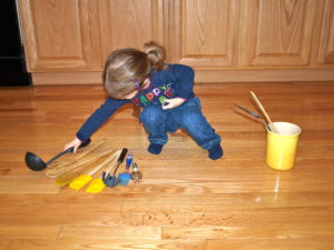 Meghan playing in kitchen
