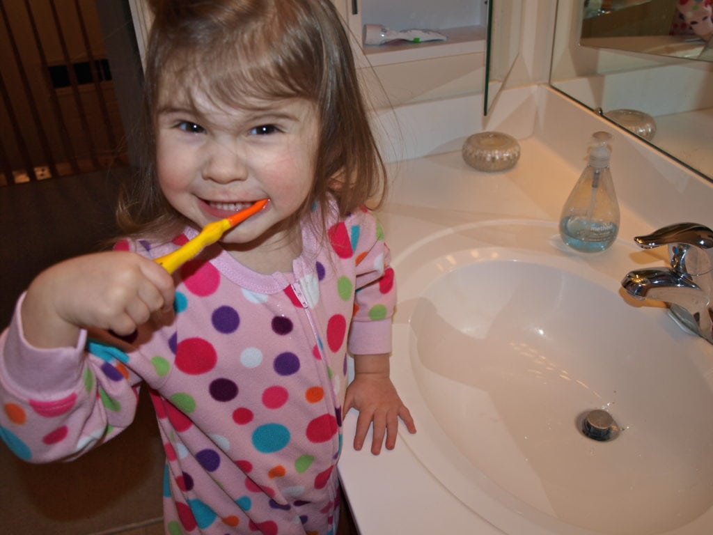 Meghan brushing her teeth