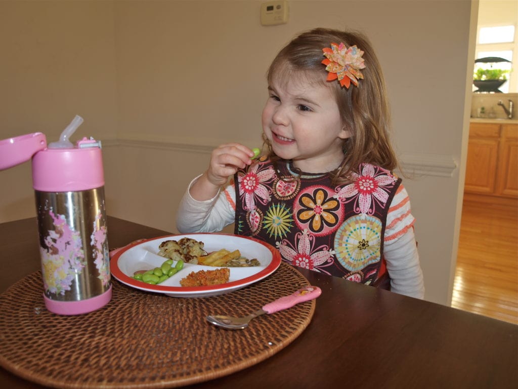 Meghan eating edamame