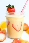 Vitamin C Fruit Smoothie recipe orange smoothie with a strawberry garnish