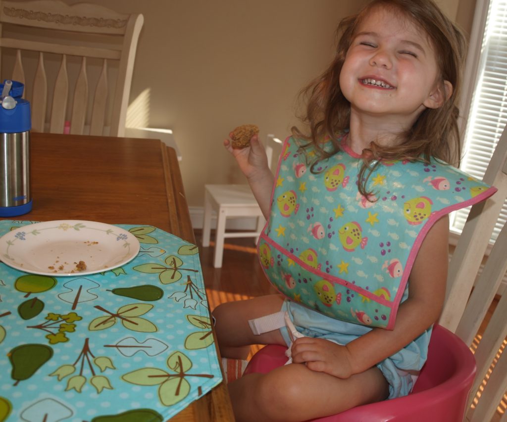 Meghan eating wholesome vegan zucchini muffin