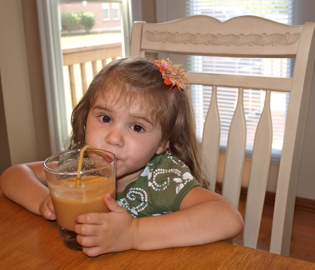 Meghan drinking a carrot cake smoothie