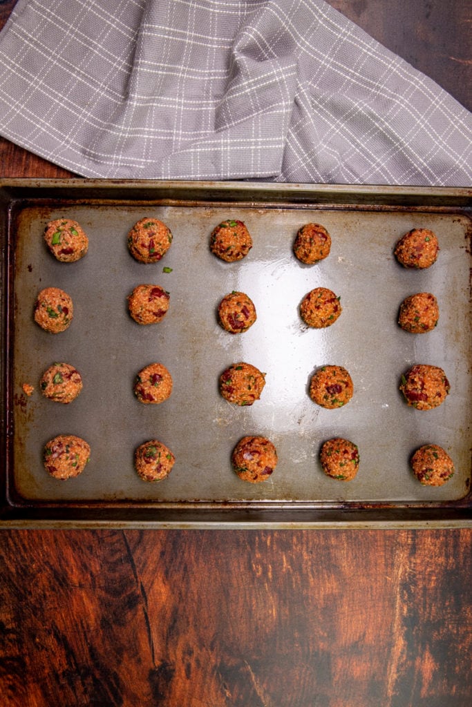 quinoa pizza balls on a b baking sheet