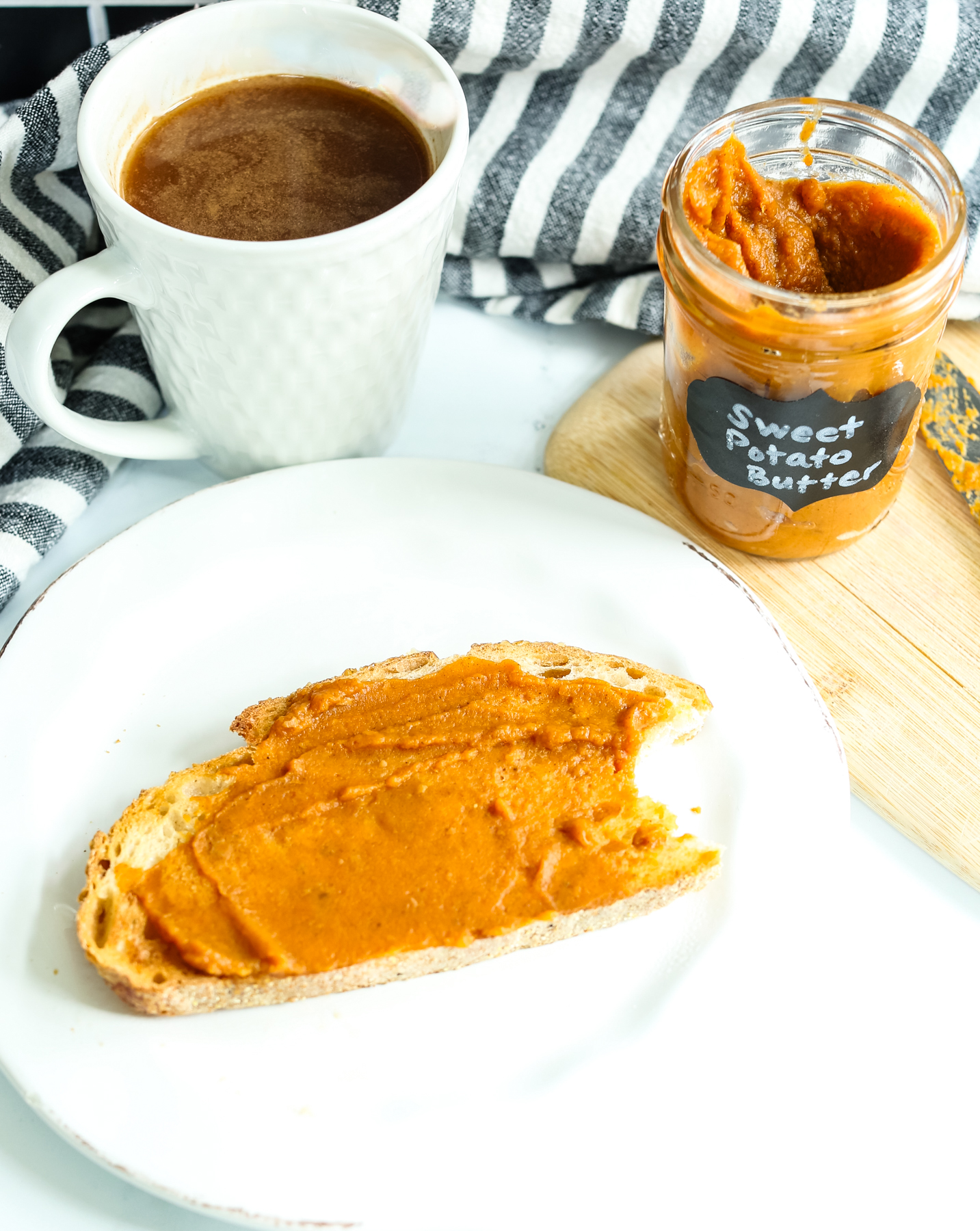 a piece of toast with a creamy orange spread on it