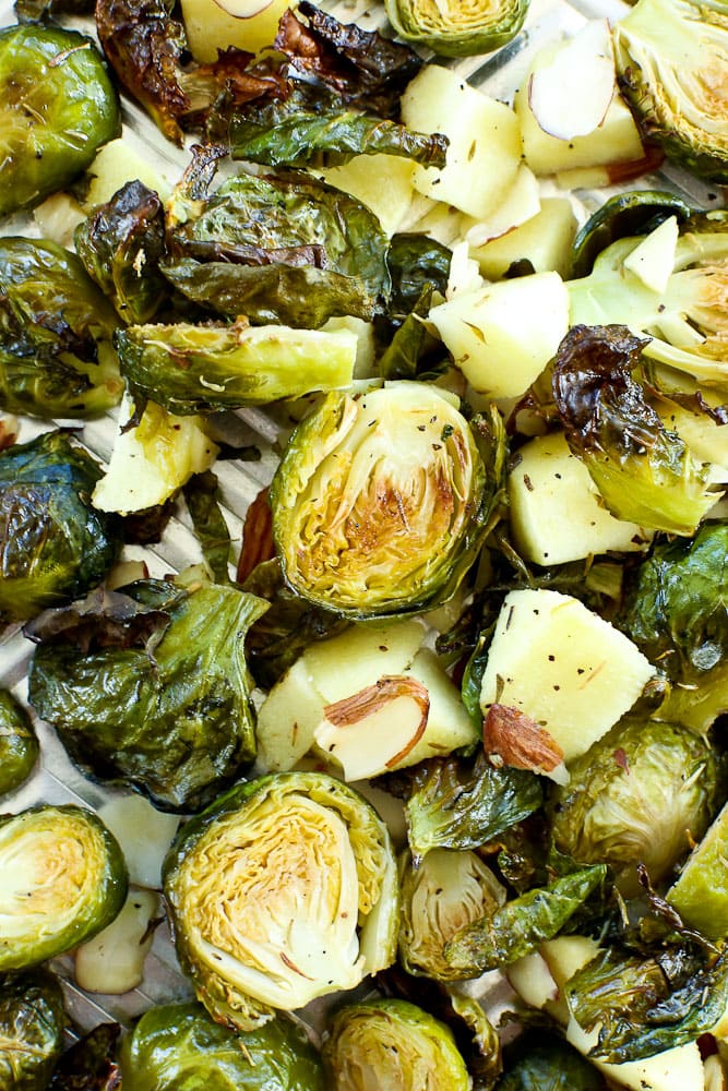 Close up of roasted brussels sprouts with apples and almonds recipe