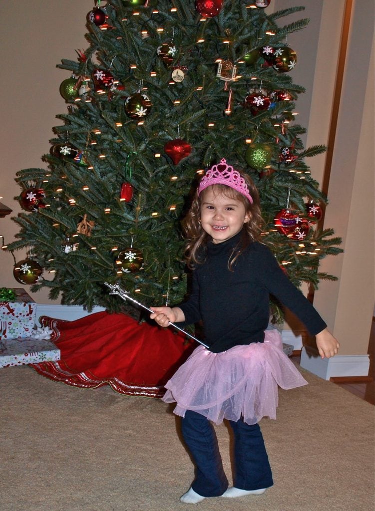 Meghan dancing by Christmas tree