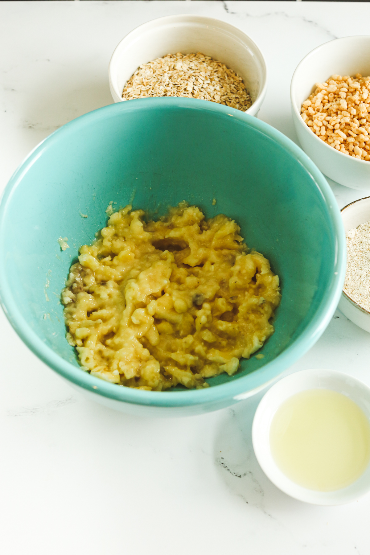 Mashed banana in a blue bowl