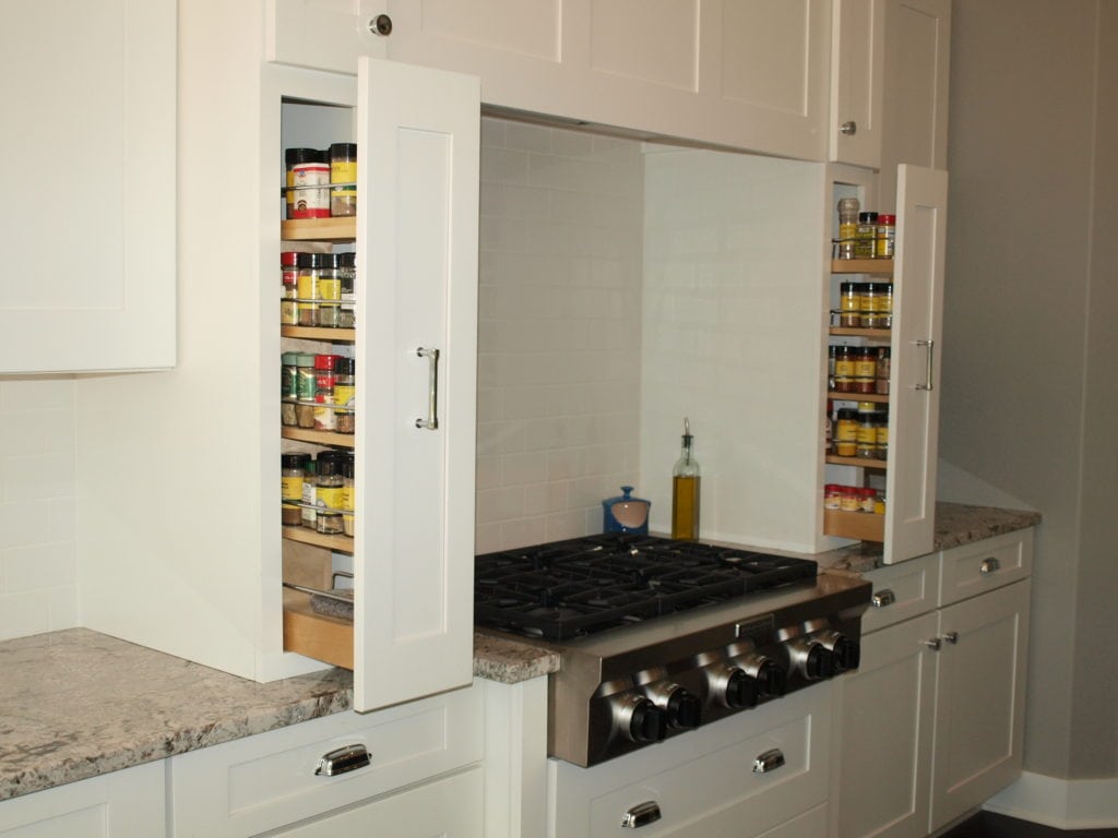 Pull out spice racks right by the stove. My dream kitchen! Lots of pictures and details.