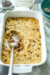recipe for Coconut Chocolate Chip Baked Oatmeal whole pan with spoon serving