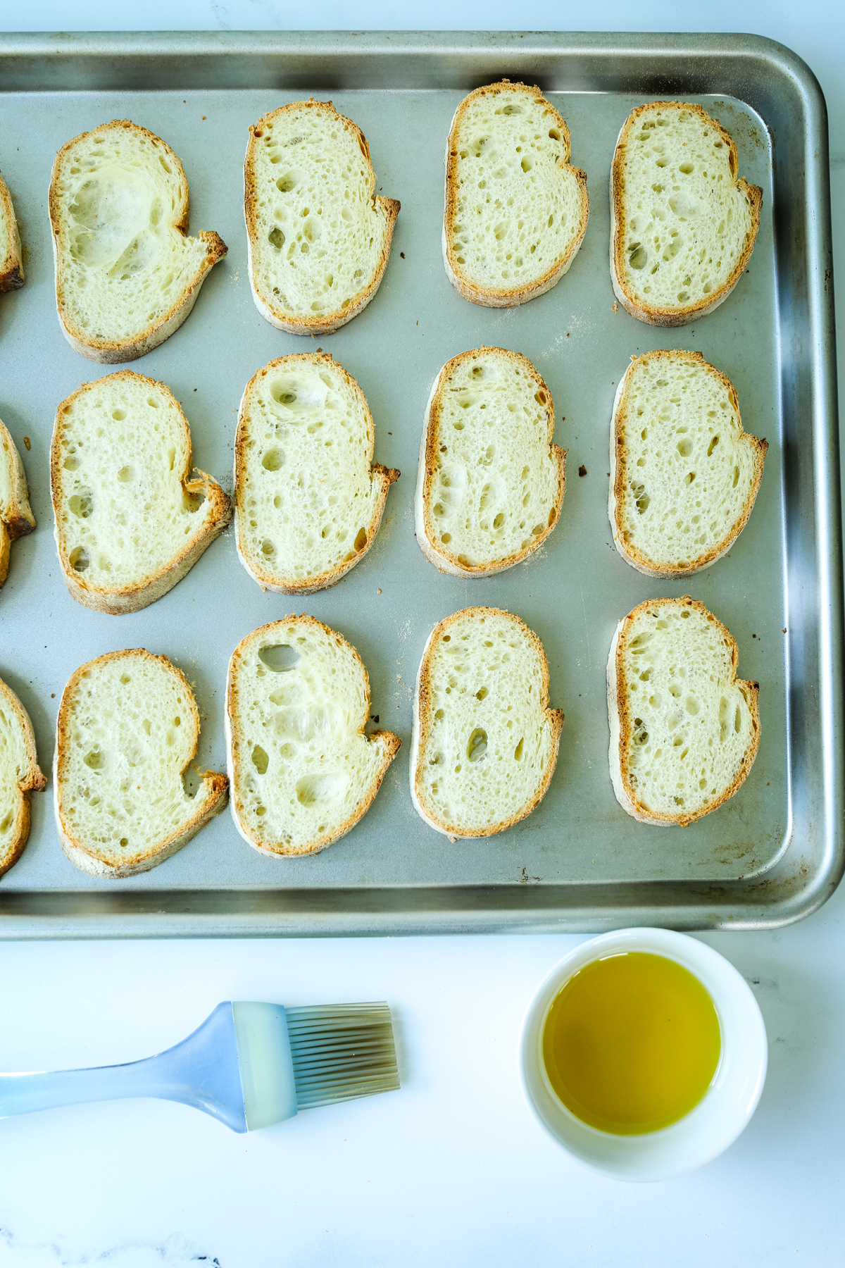 bread slices on a baking sheet