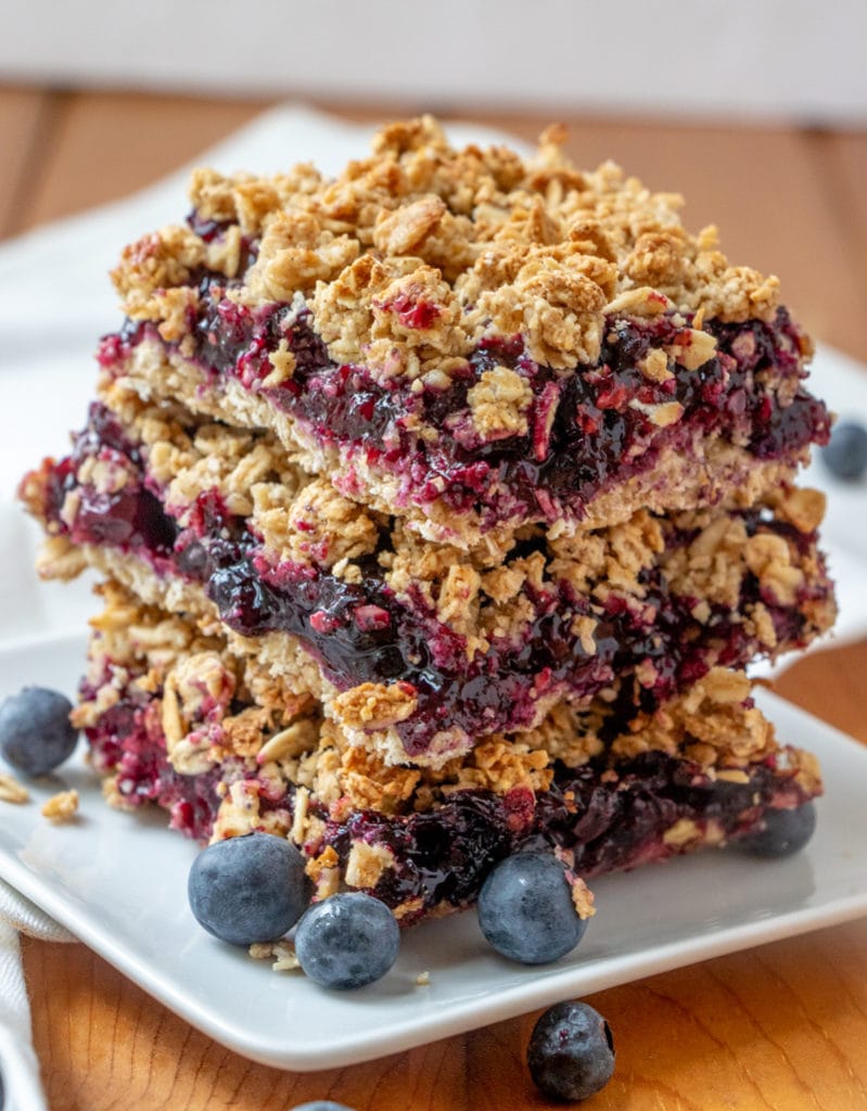 BLUEBERRY OAT BARS recipe stacked on a plate