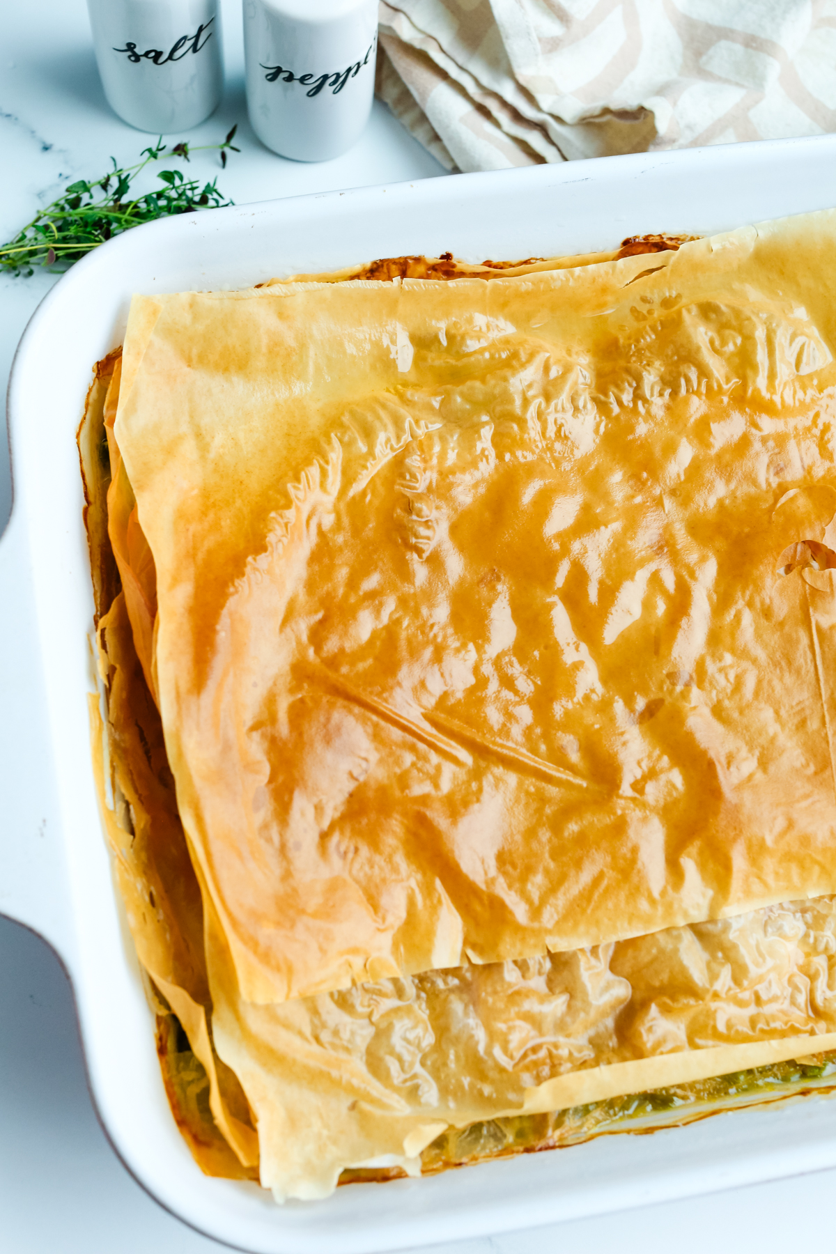 baked, golden brown phyllo dough on top of casserole dish