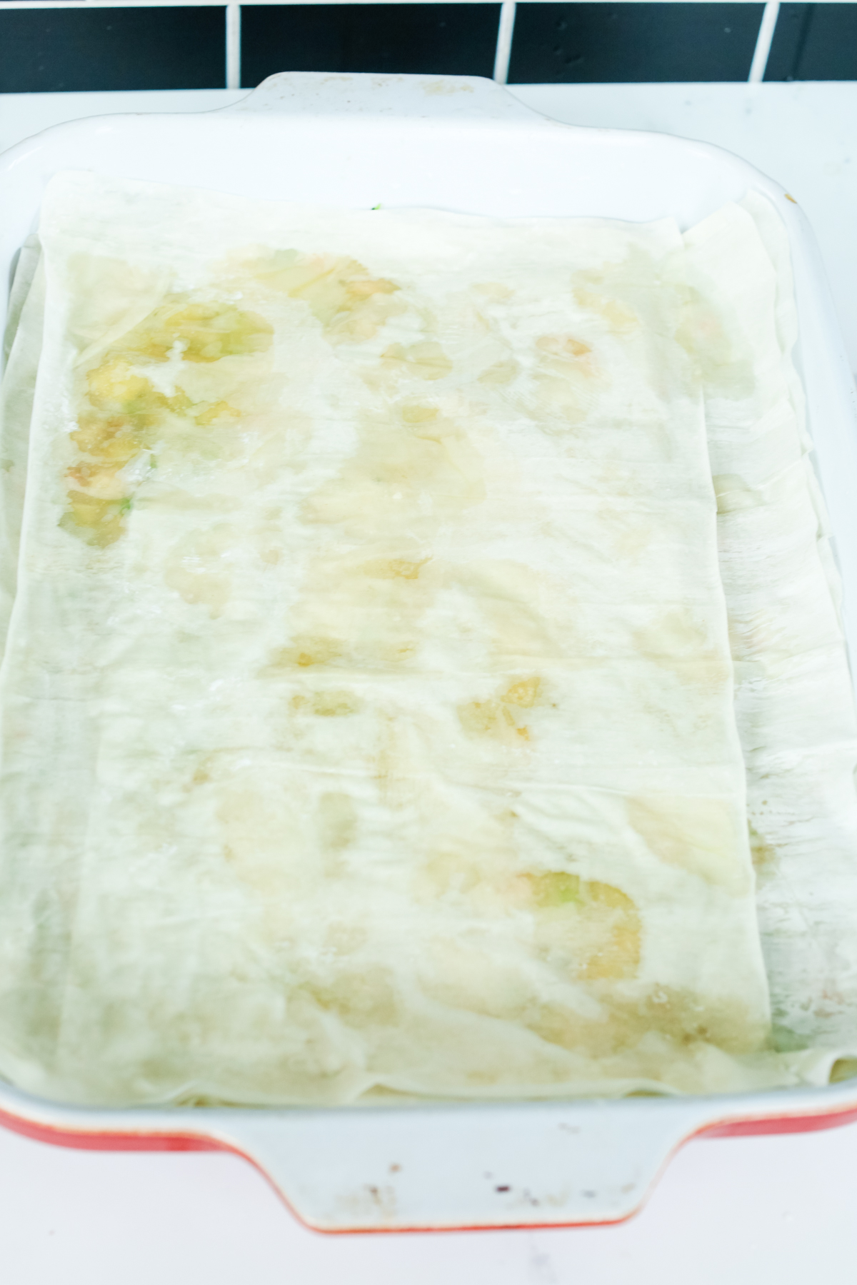 uncooked phyllo dough in a large casserole dish