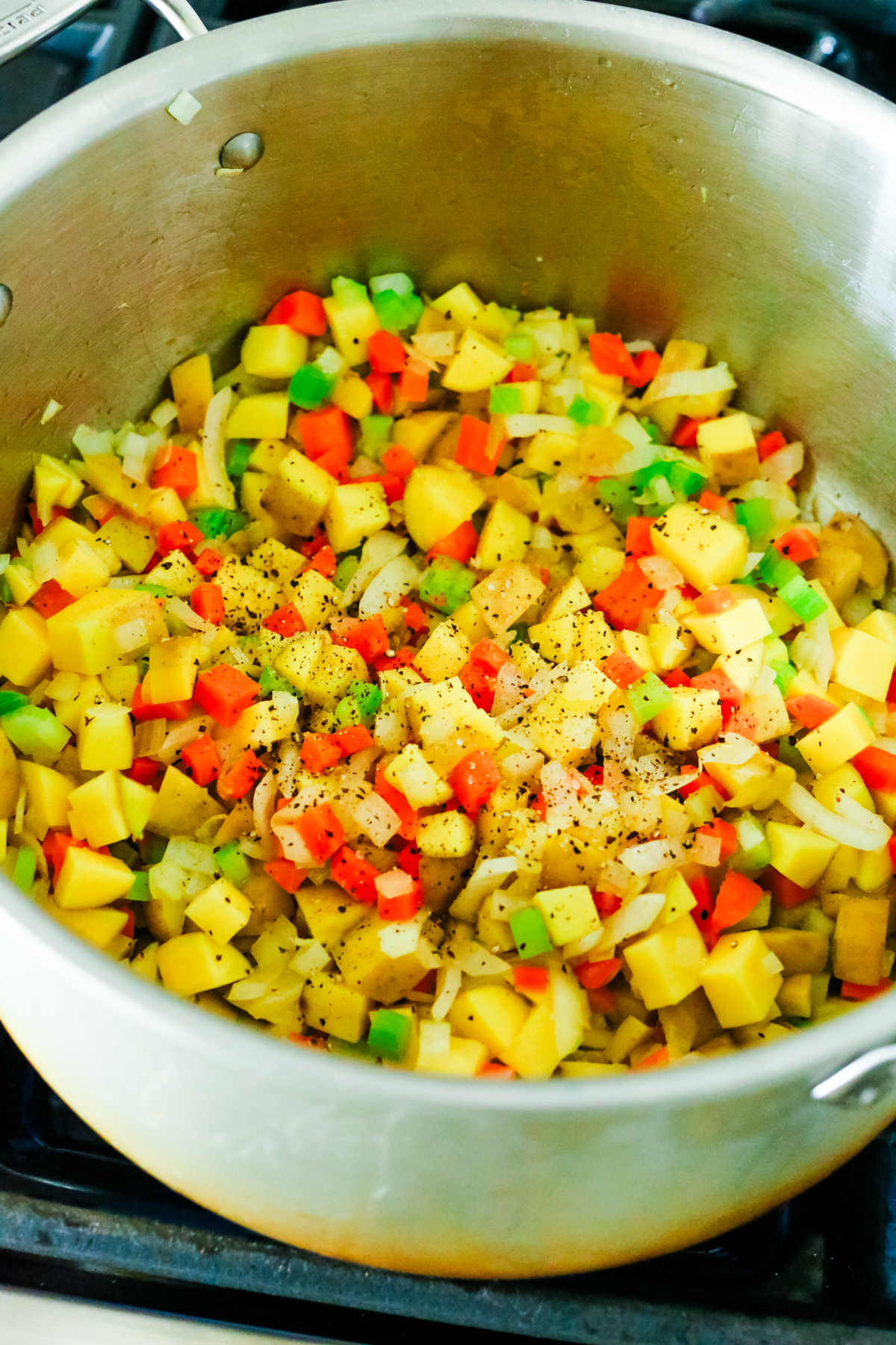 a big pot of vegetables on the stove