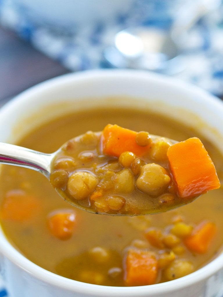 This Crockpot Vegan Coconut Curry Chickpea Lentil Soup is the easiest soup to make and is full of flavor! Low calorie, too!