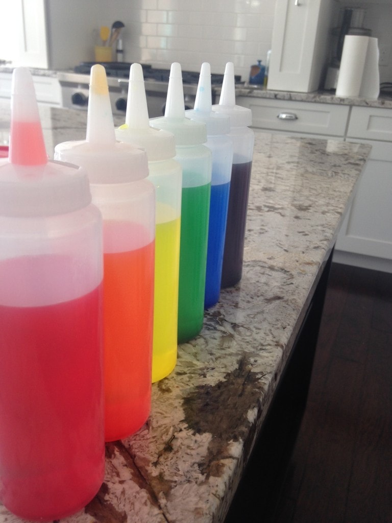 Snow Art. All you need are some squeeze bottles, water, and food coloring to create fun snow art. Come see what we created! Great snow day winter activity for kids.