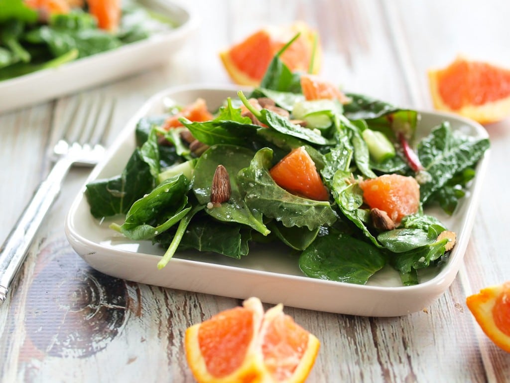 This Power Greens Salad with Cara Cara Orange, Almonds, and Parmesan is anything but boring! Brighten up your winter with this perfect salad.