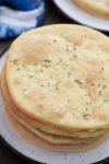 Gluten free flatbread in a stack on a plate