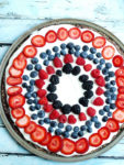 Easy Fresh Fruit No Bake Dessert PIzza Recipe. This is a clean-eating recipe with all real foods! A special treat that is perfect for the 4th of July desserts or any time of the summer! #dessert #fruitpizza #nobake #healthy #glutenfree #4thofjuly #memorialday #redwhiteandblue #patrioticdessert