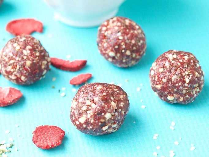 Strawberry Shortcake Energy Balls recipe. These energy bites taste like CAKE!! So easy to make and these are a perfect healthy snack. We love these as a portable grab-and-go snack. Gluten-free, vegan.