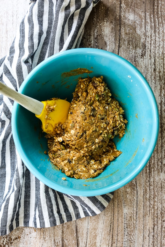 mixing the ingredients together in a blue bowl