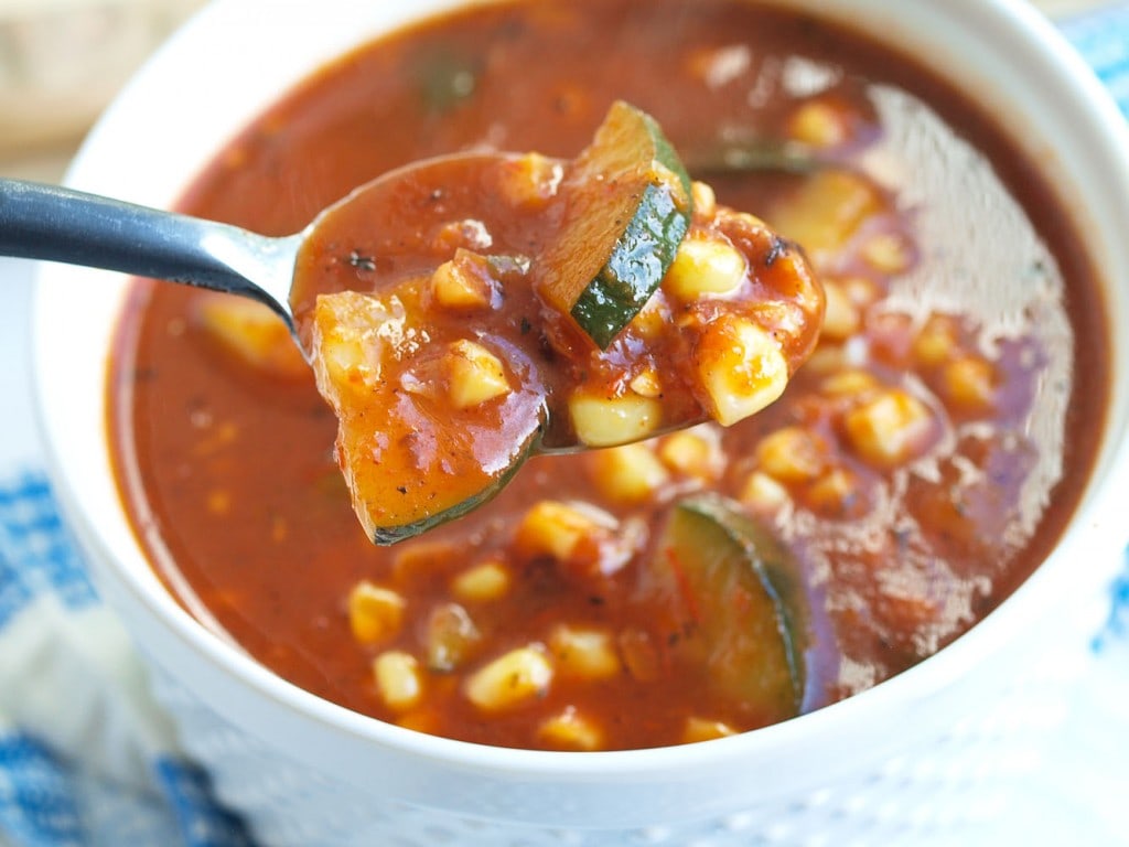 This Roasted Tomato and Red Pepper Soup with Zucchini and Corn soup is beyond incredible. You will not be disappointed with this recipe! A healthy soup recipe filled with summer's best produce.