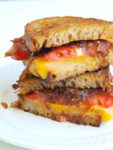 The Ultimate Grilled Cheese Sandwich with Caramelized Onions and Tomato. This is the BEST recipe for twist on the classic grilled cheese. So much better!